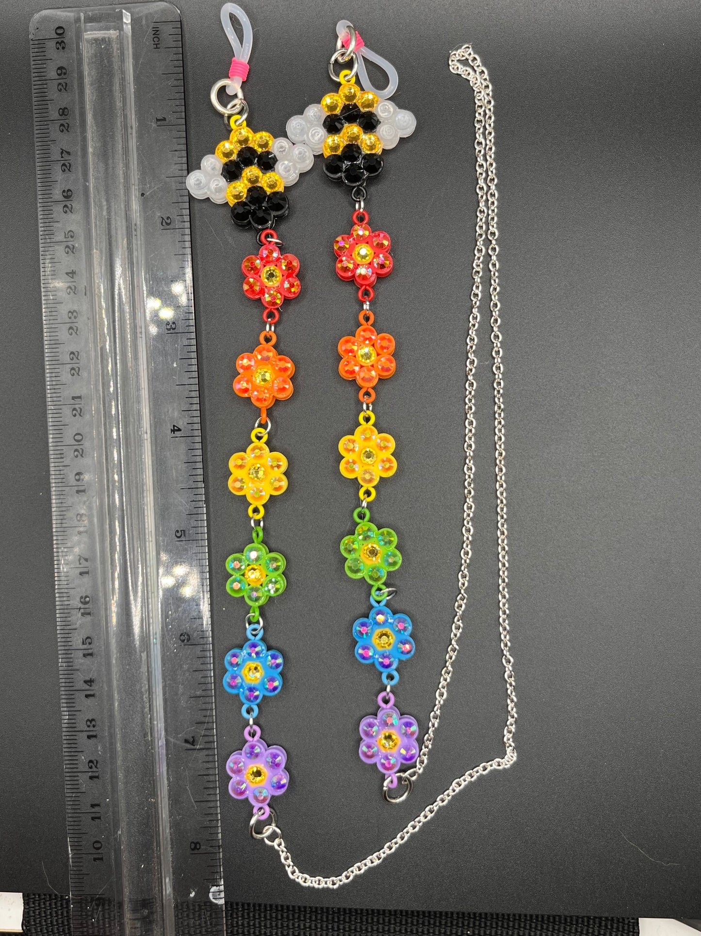 Rainbow and bee charm rhinestoned 33” eyeglass chain made with fused beads and glass rhinestones.